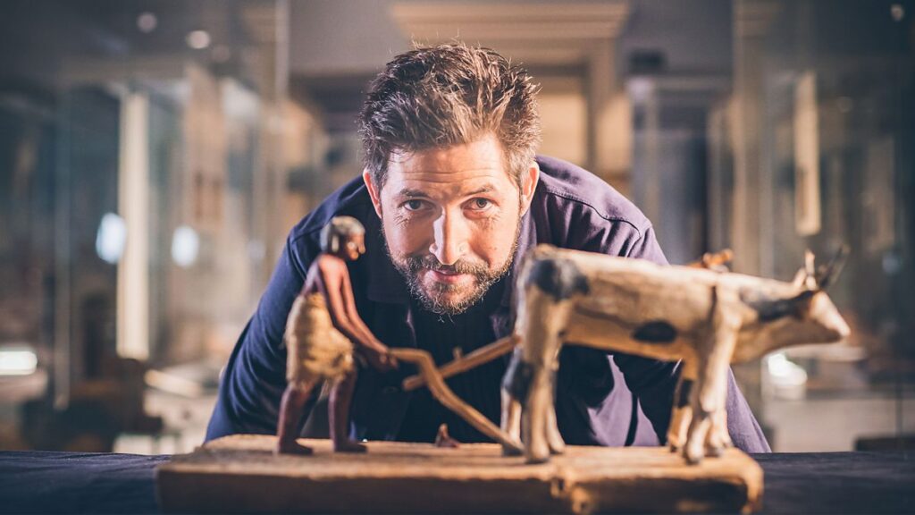 James Fox looks at an Egyptian figurine
