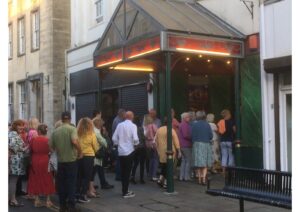 credit:People queue to go in to The Lyric, Carmarthen